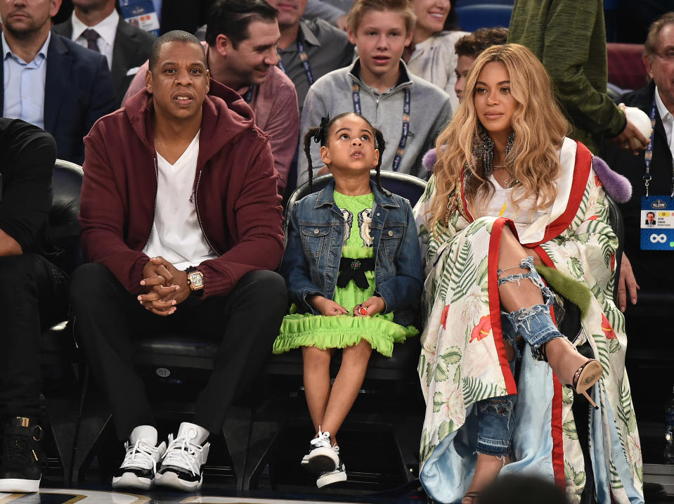 Jay-Z, Blue Ivy Carter and Beyonce Knowles attend a basketball game in 2017 in New Orleans, Louisiana. [Theo Wargo/Getty Images]