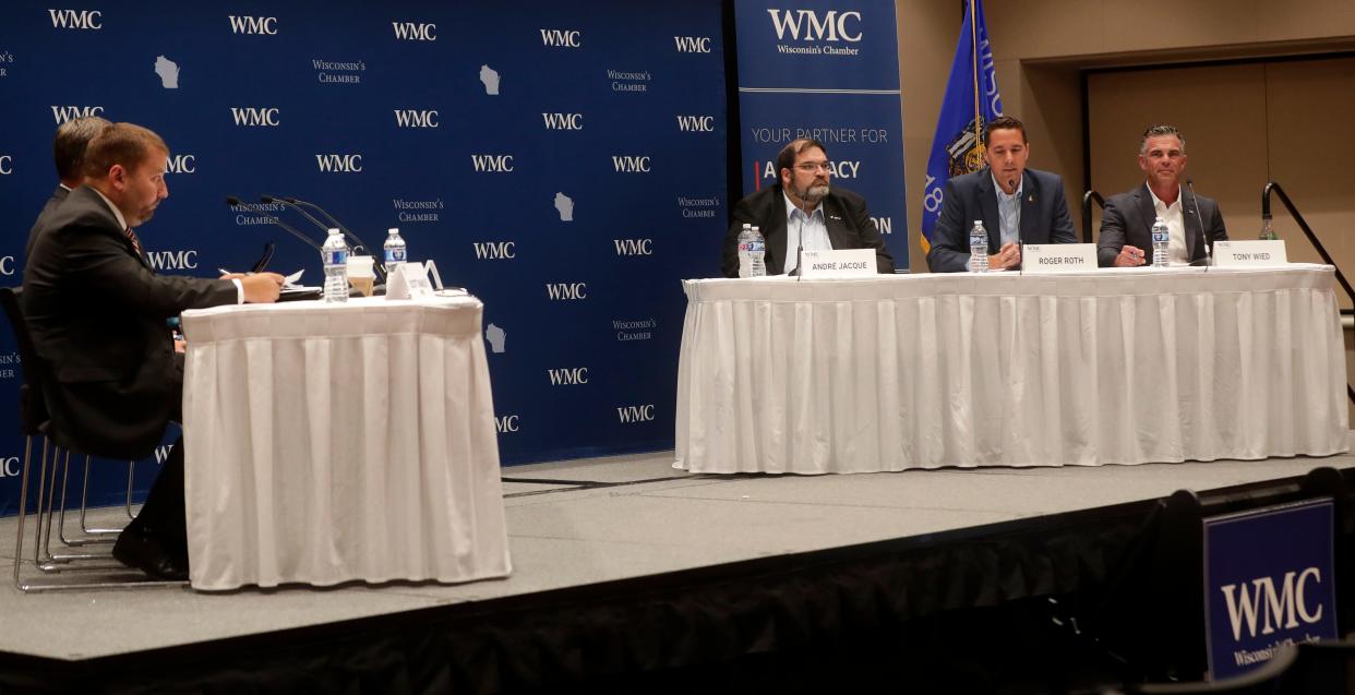 Sen. Andre Jacque, from left, former Sen. Roger Roth and businessman Tony Wied participate in a debate for Republican candidates running for Wisconsin’s 8th Congressional District on Thursday at the KI Convention Center in Green Bay.