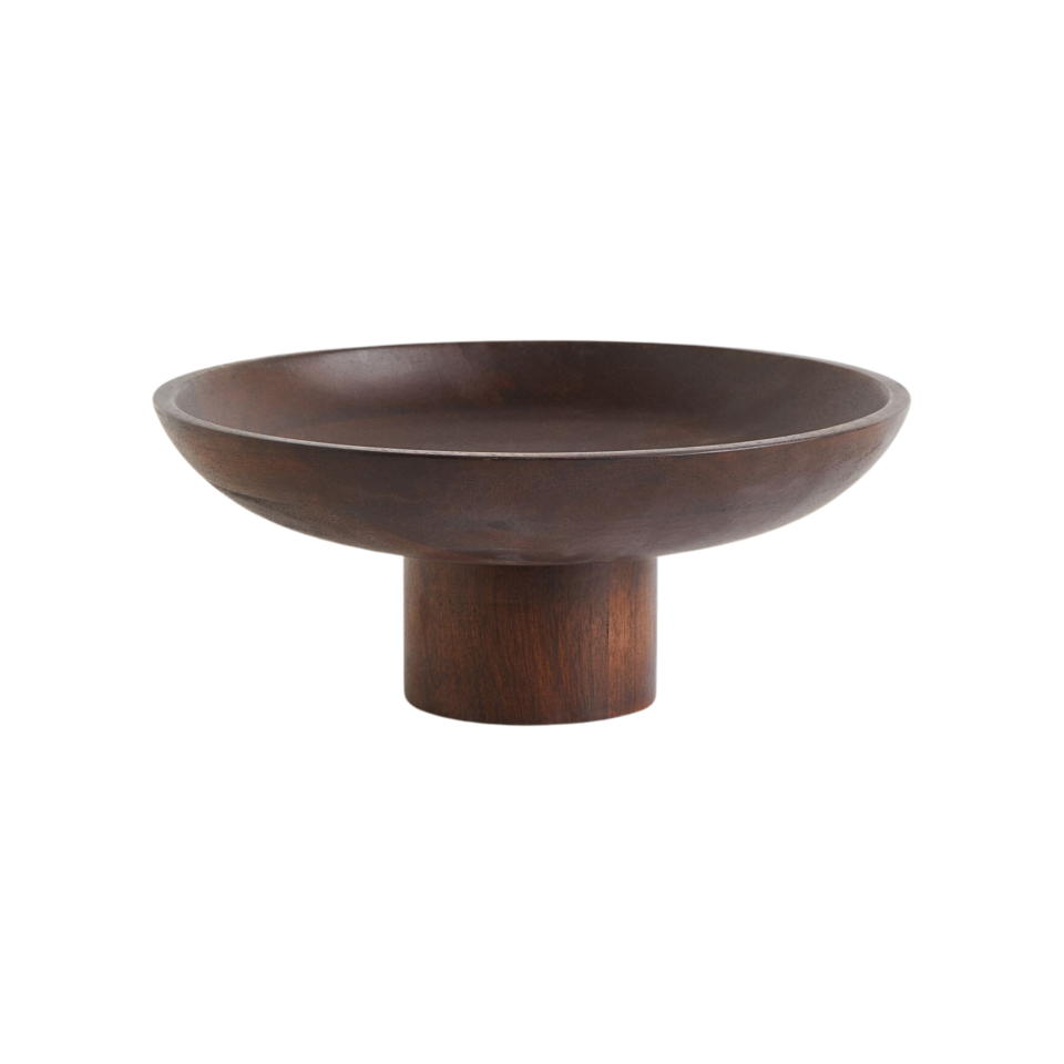 A dark wooden pedestal bowl