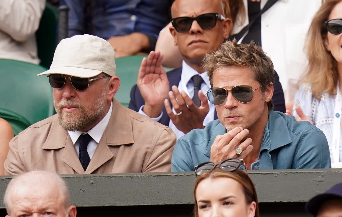 Brad Pitt (right) and Guy Ritchie (left) watching the Gentlemen's Singles final on day fourteen of the 2023 Wimbledon Championships (PA)