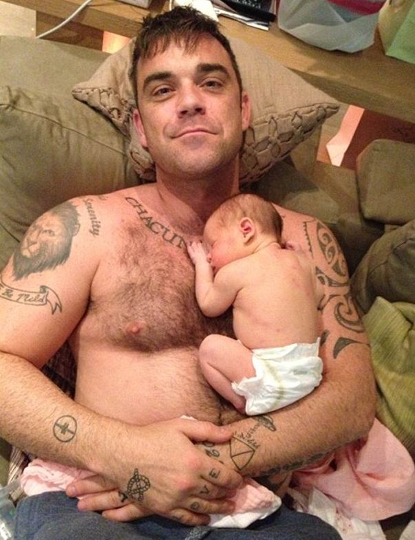 Robbie Williams with baby Teddy (PA)