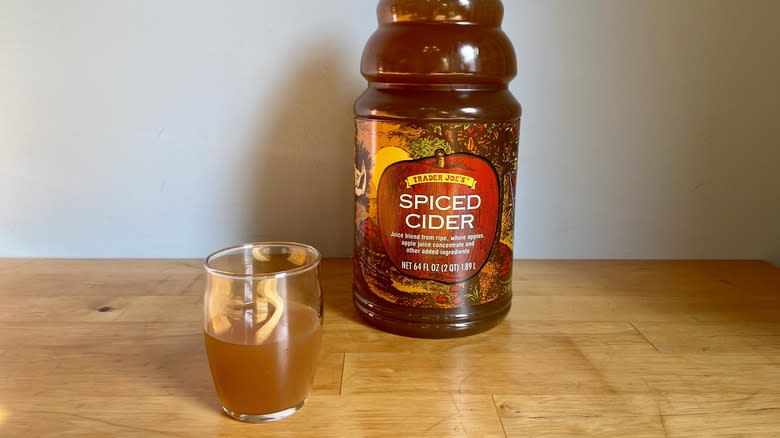 Trader Joe's Spiced Cider in glass cup with bottle