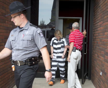 Joyce Mitchell is escorted out of the court house after pleading guilty at Clinton County Court, in Plattsburgh, New York July 28, 2015. REUTERS/Christinne Muschi