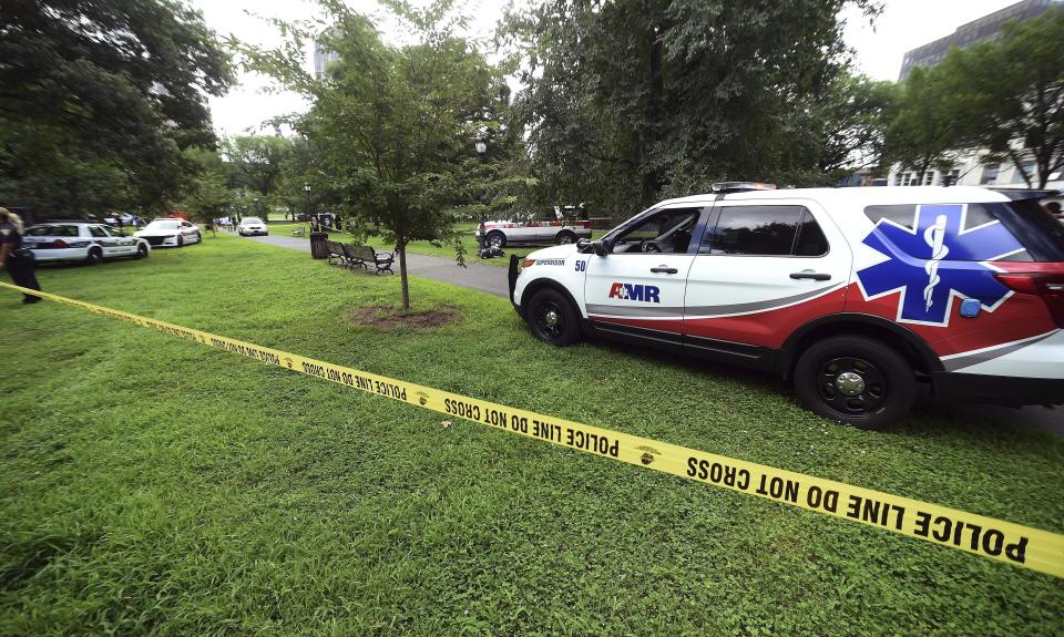 New Haven emergency personnel respond to overdose cases on the New Haven Green in Connecticut on Wednesday, Aug. 15, 2018. More than 30 people overdosed Wednesday from a suspected bad batch of “K2” synthetic marijuana at or near a city park in Connecticut. No deaths were reported, but officials said two people had life-threatening symptoms. (Arnold Gold/New Haven Register via AP)