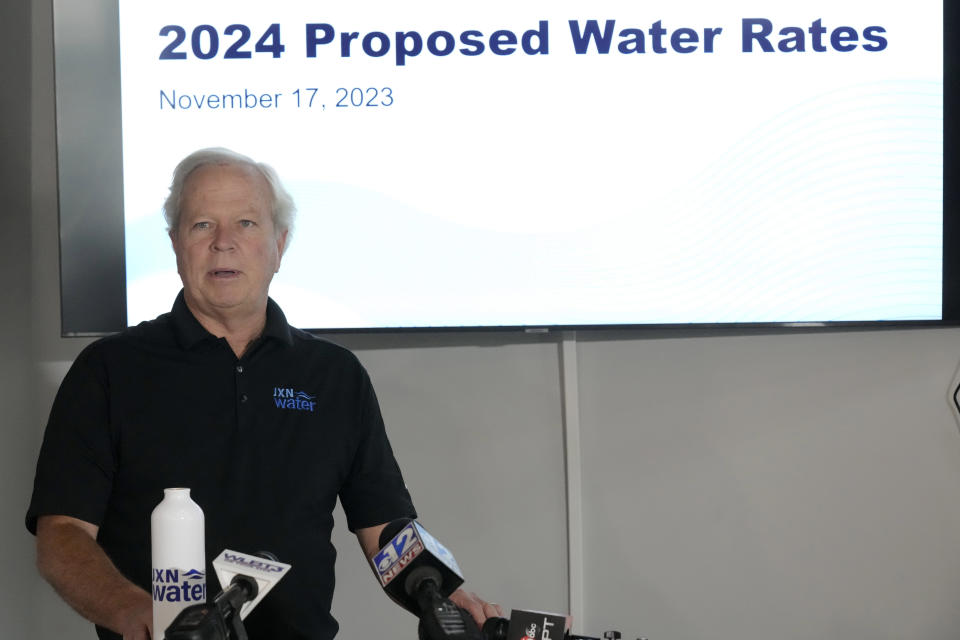 Ted Henifin, interim third-party manager for JXN Water, the water system for the city of Jackson, Miss., explains his proposal for a slight rate increase Friday, Nov. 17, 2023, during a news conference in Jackson. Henifin believes the proposal, includes what might be a national first proposal to reduce water bills for low-income people. (AP Photo/Rogelio V. Solis)