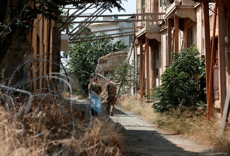 United Nations Peacekeeping Force in Cyprus (UNFICYP) officers patrol inside the buffer zone that slices between the internationally recognised Republic of Cyprus and the Turkish-occupied north, in Nicosia on June 14, 2018