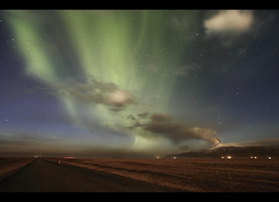 Amazing pictures of Northern Lights over the the Eyjafjallajoekull Volcano eruption on April 24, 2010 in Iceland. Eruptions under a glacier in the Eyjafjallajoekull area seem a long way away but the smokey fallout caused by the eruption interacting with ice and water hundreds of miles away has caused disruption to many flights and left hundreds holidaymakers stranded abroad. (Photo by Orvar Atli Thorgeirsson/ Barcroft Media / Getty Images)