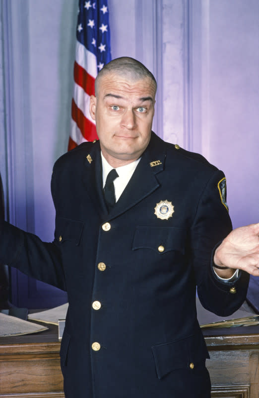 <p>NBC/Getty Images</p><p><strong>Richard Moll </strong>starred as the beloved bailiff Bull, whose sweet and humble nature belied his 181 I.Q. He's as tall as his character is smart, clocking in at a cool 6'8".</p><p>At the time of his audition, Moll had shaved his head for another role, but the team (and audiences) loved it so much that he kept himself bald for the duration of the series.</p>