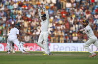 India's captain Virat Kohli (R) and wicketkeeper Wriddhiman Saha (C) unsuccessfully appeal for the wicket of South Africa's Imran Tahir during the first day of their third test cricket match in Nagpur, India, November 25, 2015. REUTERS/Amit Dave