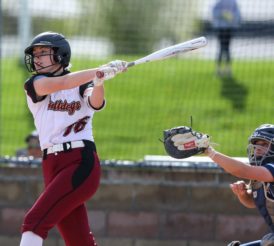 Emma Oshel of Stow-Munroe Falls fouls off a pitch during a softball game at home against Hudson in April of 2021.