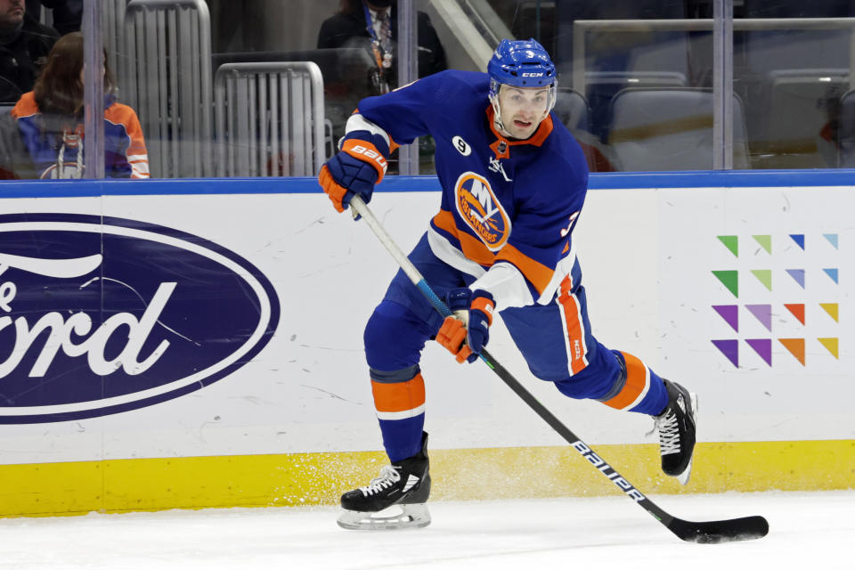 New York Islanders defenseman Adam Pelech (3) passes the puck during the first period of an NHL hockey game against the Philadelphia Flyers, Tuesday, Jan. 25, 2022, in Elmont, N.Y. (AP Photo/Corey Sipkin)