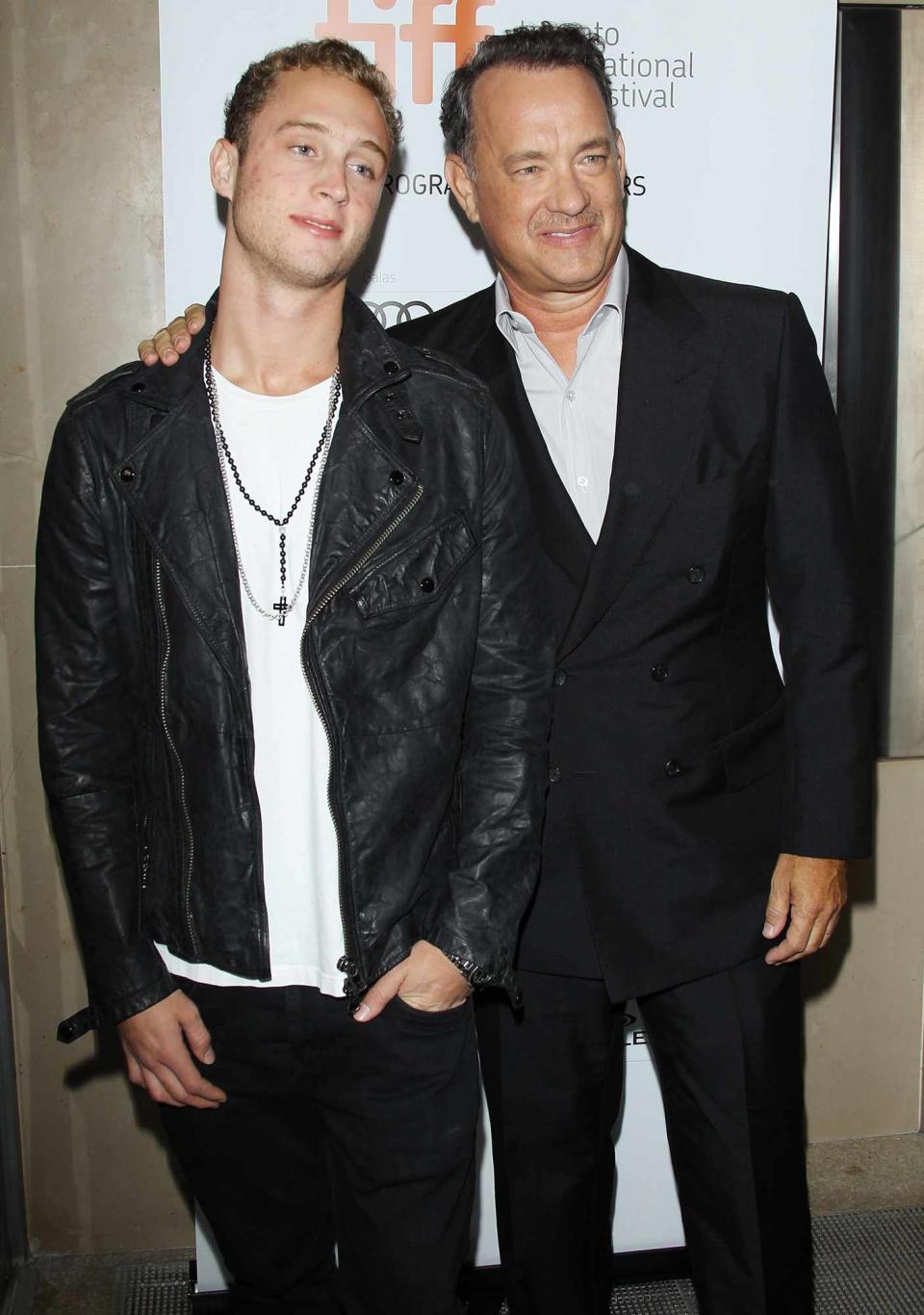 Tom Hanks (R) and his son Chet Hanks arrive at "Cloud Atlas" premiere during the 2012 Toronto International Film Festival held at Princess of Wales Theatre on September 8, 2012 in Toronto, Canada