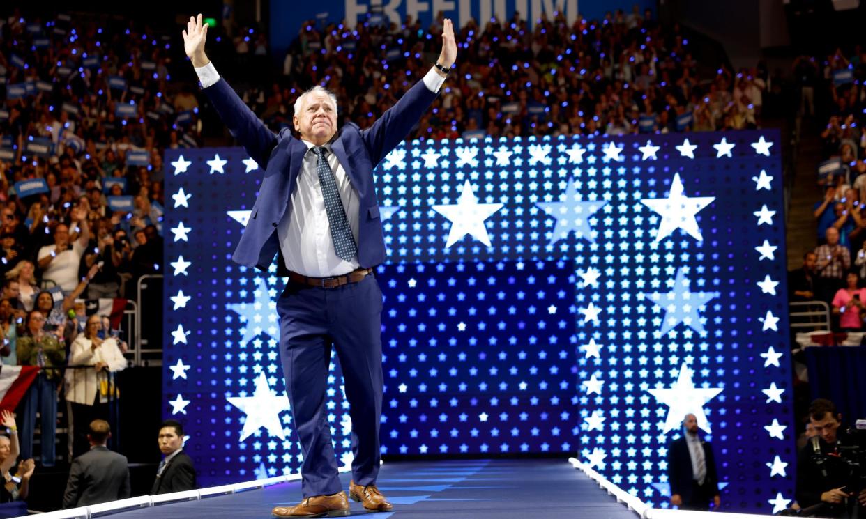 <span>Tim Walz walks offstage after speaking at a campaign rally at the Fiserv Forum in Milwaukee, Wisconsin.</span><span>Photograph: Anna Moneymaker/Getty Images</span>