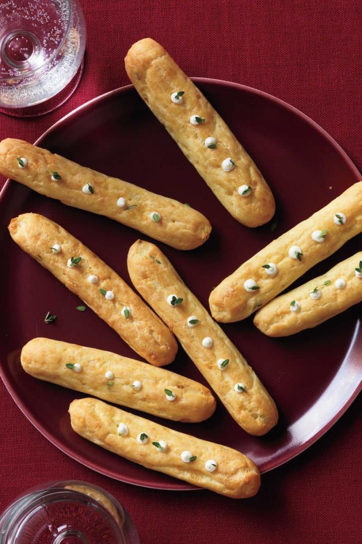 <p>Simple but oh-so-satisfying, these rich, cheese-filled pastries are sure to be a big hit this holiday season. </p><p><a href="https://www.womansday.com/food-recipes/food-drinks/recipes/a12446/parmesan-pastry-pipes-recipe-wdy1213/" rel="nofollow noopener" target="_blank" data-ylk="slk:Get the Parmesan Pastry Pipes recipe." class="link rapid-noclick-resp"><em><strong>Get the Parmesan Pastry Pipes recipe.</strong></em></a> </p>