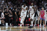 Miami Heat center Bam Adebayo (13) celebrates after scoring during the second half of an NBA basketball game against the Washington Wizards, Friday, Nov. 25, 2022, in Miami. (AP Photo/Wilfredo Lee)