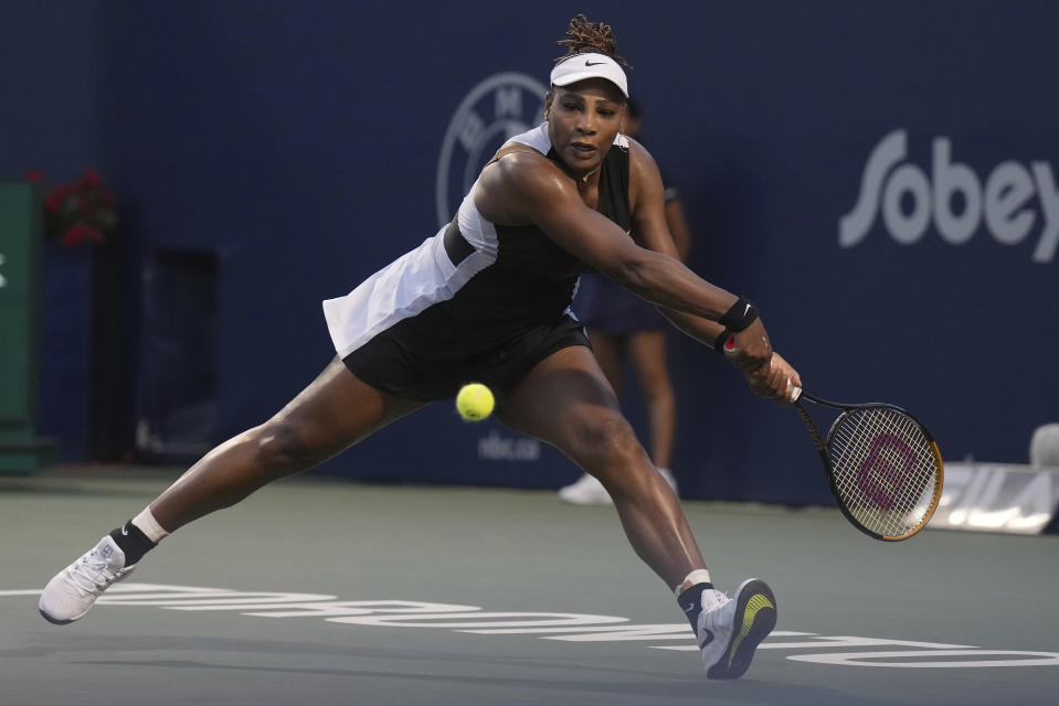 Serena Williams, of the United States, runs down a shot from Belinda Bencic, of Switzerland, during the National Bank Open tennis tournament Wednesday, Aug. 10, 2022, in Toronto. (Nathan Denette/The Canadian Press via AP)