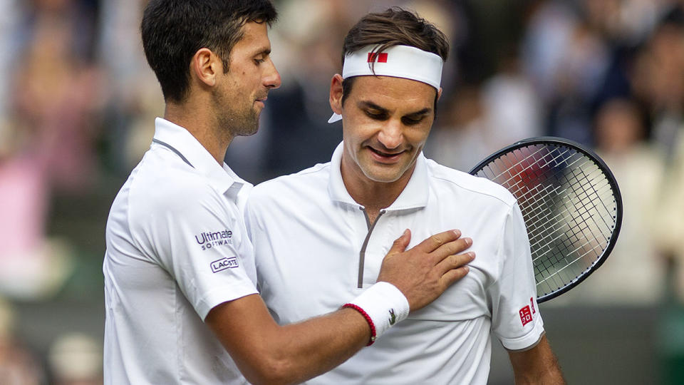 Novak Djokovic and Roger Federer after their epic Wimbledon final. (Photo by Tim Clayton/Corbis via Getty Images)