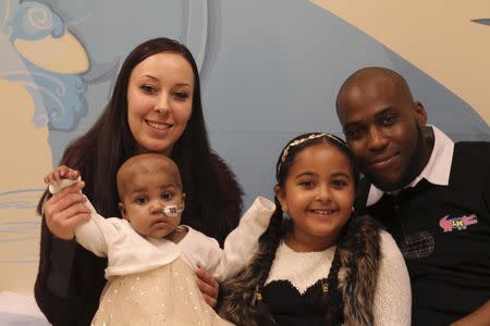 Baby Layla (L) is seen with her parents, Lisa and Ashleigh, and her older sister Reya at Great Ormond Street Hospital (GOSH) in London in this November 4, 2015 handout photo by the hospital released on November 5, 2015. REUTERS/Great Ormond Street Hospital/Handout via Reuters.
