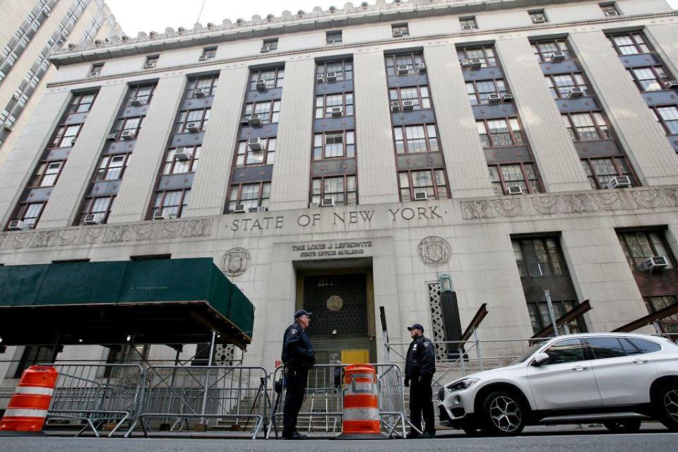 NYPD officers provide security outside the Manhattan district attorney's office in New York City on March 31, 2023. / Credit: LEONARDO MUNOZ/AFP via Getty Images