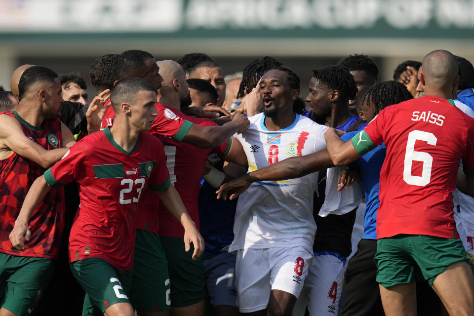 Players of Morocco and Congo argue after the final whistle of the African Cup of Nations Group F soccer match between Morocco and DR Congo, at the Laurent Pokou stadium in San Pedro, Ivory Coast, Sunday, Jan. 21, 2024. (AP Photo/Themba Hadebe)