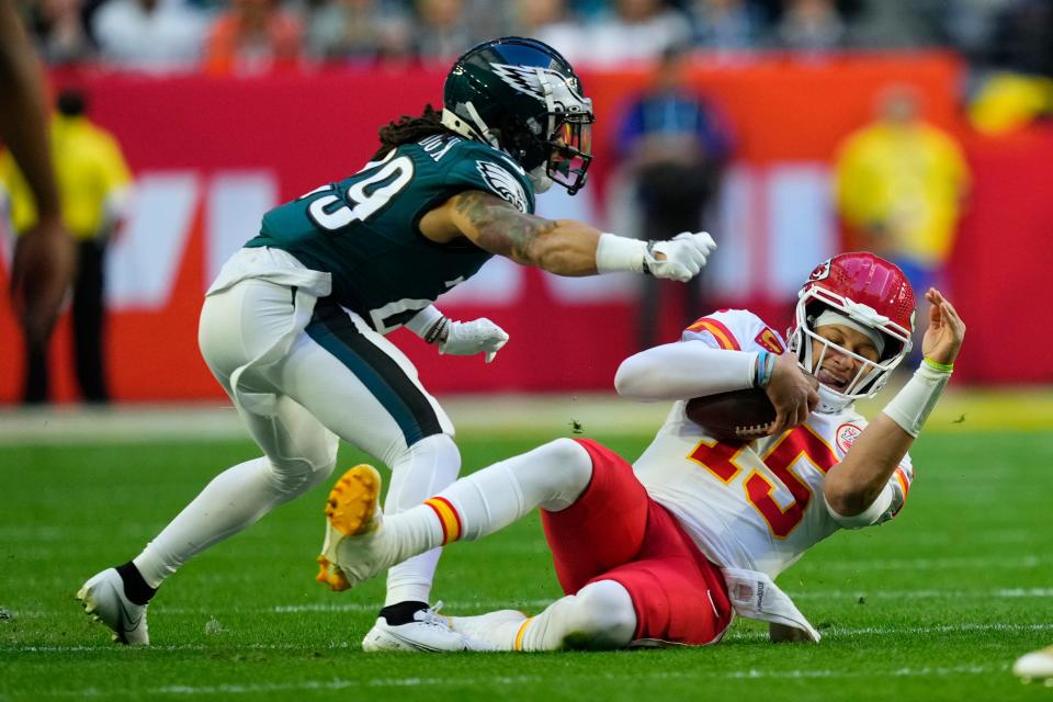 Kansas City Chiefs quarterback Patrick Mahomes (15) runs the ball as Philadelphia Eagles cornerback Avonte Maddox (29) defends during the first half of Super Bowl 57 on Sunday, Feb. 12, 2023, in Glendale, Ariz.