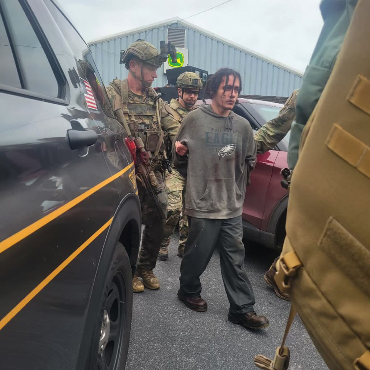Danelo Cavalcante is taken into custody at state police barracks in Avondale, Pa.