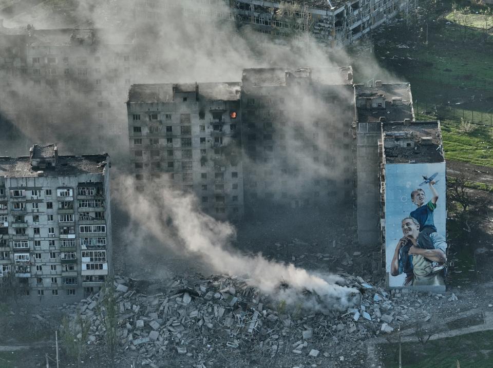 Smoke rises from a building in Bakhmut, the site of the heaviest battles with the Russian troops in the Donetsk (Copyright 2023 The Associated Press. All rights reserved.)