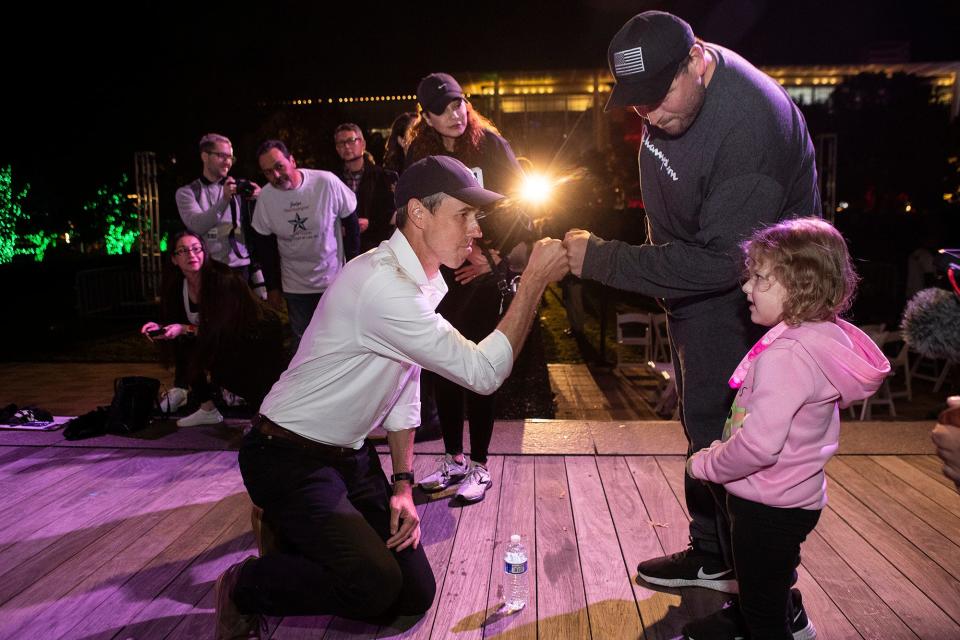 Democrat Beto O’Rourke fist bumps William Zapata, standing with his daughter, Willow, 4, as he greets supporters following a rally for his Texas gubernatorial campaign at Discovery Green Friday, Nov. 19, 2021 in Houston.