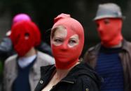 Protestors gather outside the Russian Consulate General building during a demonstration of support for the female Russian female punk band Pussy Riot in Edinburgh, Scotland August 17, 2012.