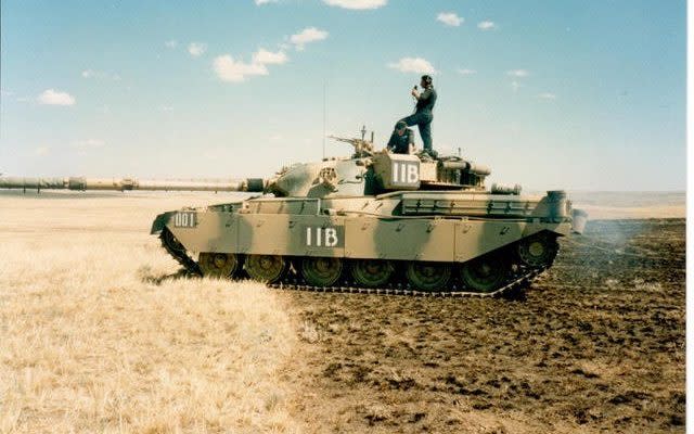 Captain Paul Cornish, sitting, on a battlegroup exercise with the Royal Tank Regiment - Captain Paul Cornish