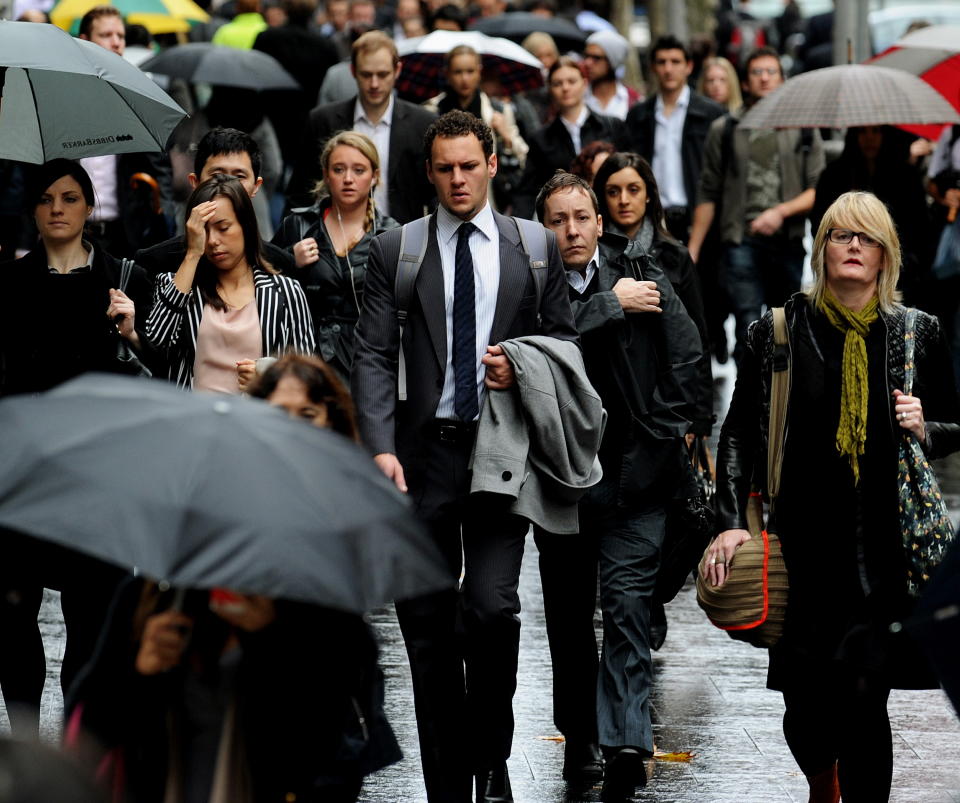 A crowd of people in Sydney in the rain.