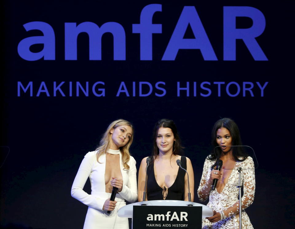 U.S. models Gigi Hadid, Bella Hadid and Chanel Iman conduct the auction during the amfAR's Cinema Against AIDS 2015 event during the 68th Cannes Film Festival in Antibes, near Cannes, southern France, May 21, 2015. REUTERS/ Regis Duvignau


