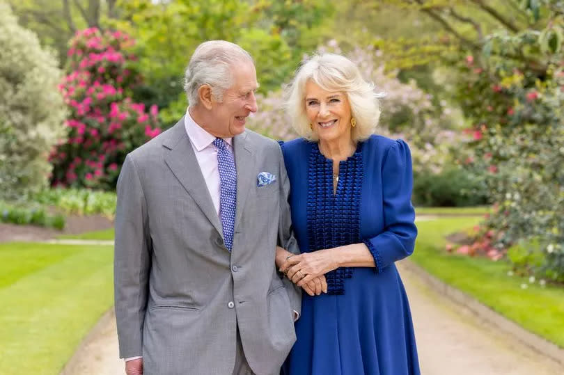 A new picture of the King and Queen Camilla, taken in Buckingham Palace Gardens on April 10, was released to mark the first anniversary of their Coronation. -Credit:Buckingham Palace/PA Wire