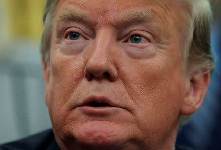 U.S. President Donald Trump listens to a question after signing "Space Policy Directive 4", the directive to establish a Space Force as the sixth branch of the Armed Forces, in the Oval Office at the White House in Washington, U.S., February 19, 2019. REUTERS/Jim Young