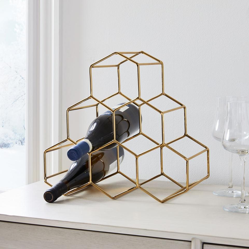 <p><a href="https://go.redirectingat.com?id=74968X1596630&url=https%3A%2F%2Fwww.westelm.com%2Fproducts%2Fhoneycomb-wine-rack-d9061&sref=https%3A%2F%2Fwww.delish.com%2Fholiday-recipes%2Fg2582%2Fwine-gifts%2F" rel="nofollow noopener" target="_blank" data-ylk="slk:Shop Now;elm:context_link;itc:0;sec:content-canvas" class="link ">Shop Now</a></p><p>Honeycomb Metal Wine Rack</p><p>West Elm</p><p>$39.99</p>