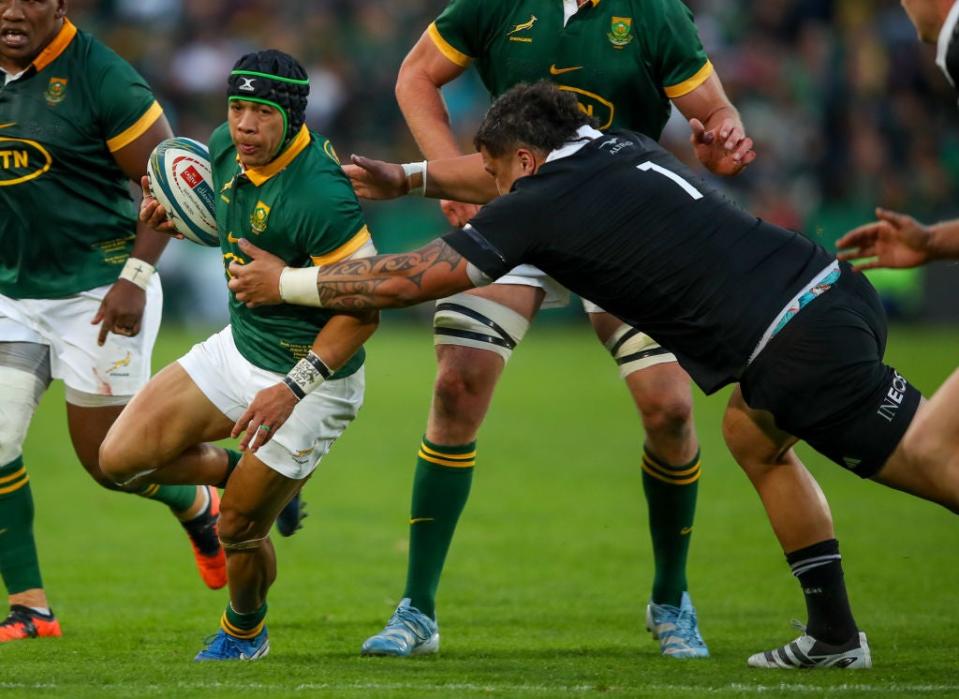 Tamaiti Williams of the All Blacks tries to tackle Cheslin Kolbe of the Springboks during last week’s match (Getty Images)