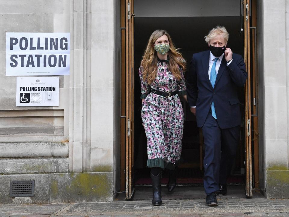 Carrie Symonds with Boris Johnson outside polling stationPA