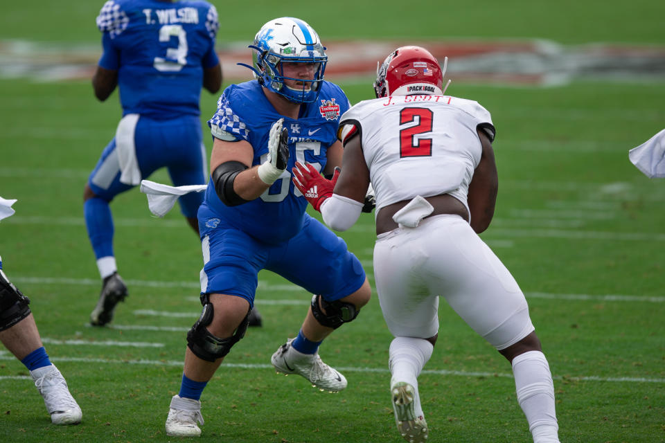 Kentucky center Drake Jackson (65) blocks North Carolina State Wolfpack linebacker Jaylon Scott (2) during the TaxSlayer Gator Bowl. (Photo by David Rosenblum/Icon Sportswire via Getty Images)