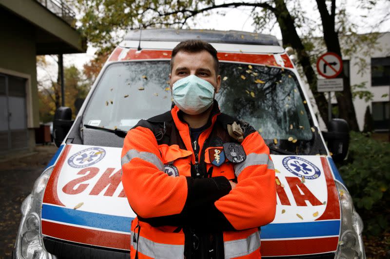 Paramedic Marcin Serwach, 35, attends an interview with Reuters amid the global outbreak of the coronavirus disease (COVID-19), at a cemetery in Warsaw