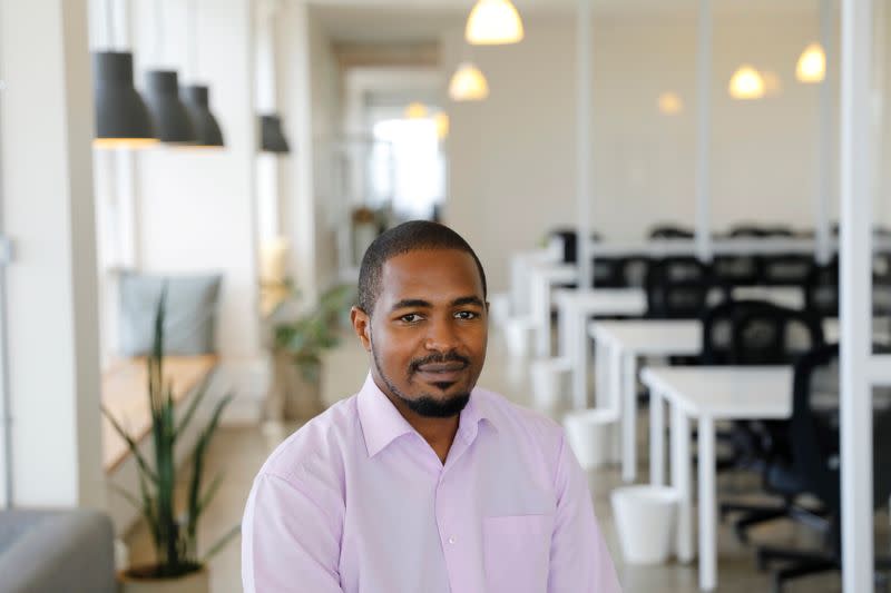 Peter Gikera, CTO & Co-Founder of the Nairobi-based TIBU startup, poses for a photo during an interview with Reuters at the office in Nairobi