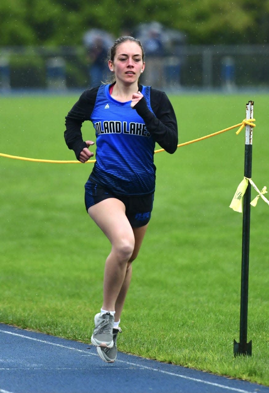 Inland Lakes' Luci Bunker runs an event during the Ski Valley Conference championship track and field meet at Inland Lakes on  Wednesday. The Bulldogs won their first Ski Valley crown since 2017 by holding off defending champion Johannesburg-Lewiston.