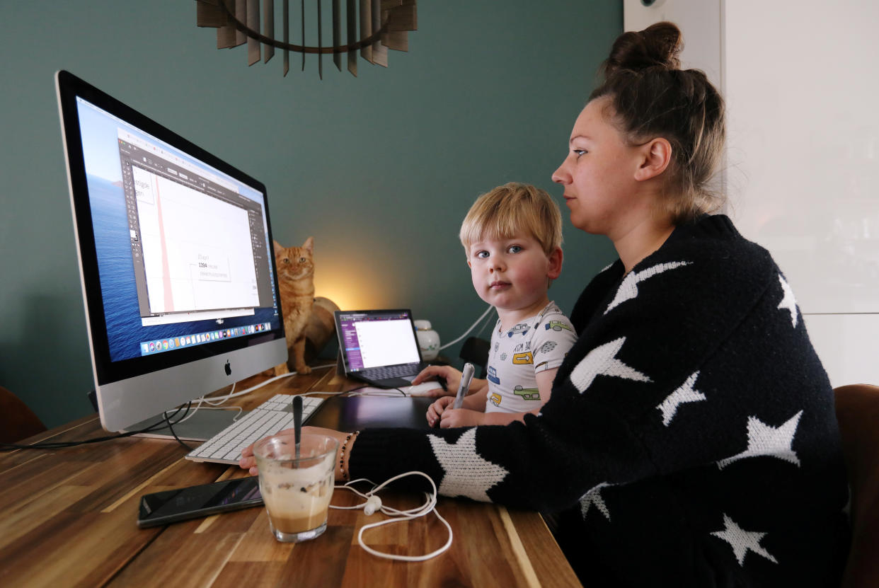 A woman works in a house while workers are forced to work from home and demand payback for extra home office costs during the coronavirus disease (COVID-19) outbreak in Sassenheim, Netherlands October 2, 2020. Picture taken October 2, 2020. REUTERS/Eva Plevier