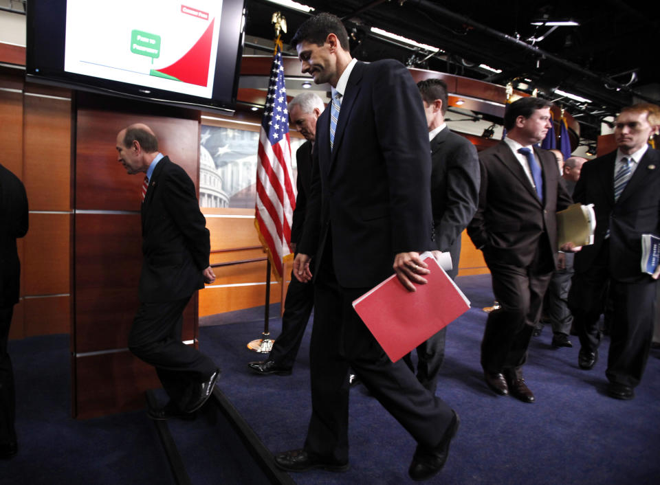 House Budget Committee Chairman Rep. Paul Ryan, R-Wis., center, and others, leave a news conference on Capitol Hill in Washington, where he discussed his budget blueprint. (AP Photo/Jacquelyn Martin)