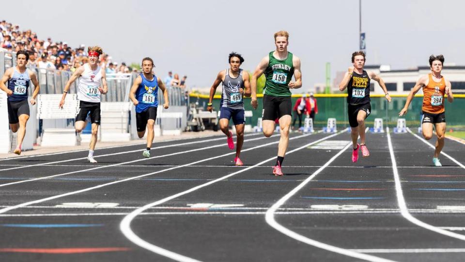 Gatlin Bair of Burley takes first place in the 4A boys 100 meters race at the 5A/4A state track and field championships held at Mountain View, Saturday, May 20, 2023. Sarah A. Miller/Sarah A. Miller