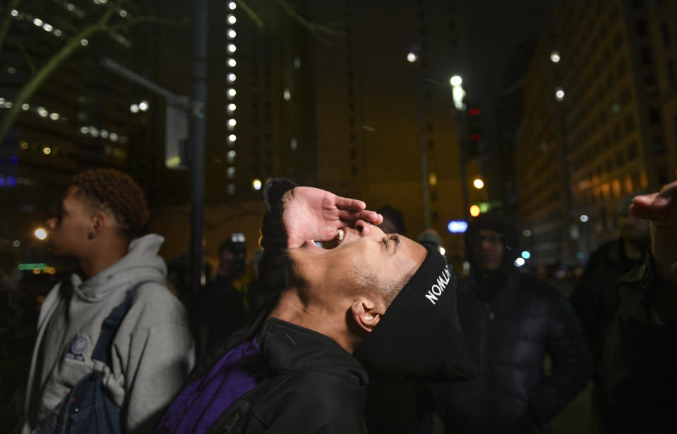Kahlil Darden, center, and other supporters of Antwon Rose II react after they learned a not guilty verdict in the homicide trial of former East Pittsburgh police Officer Michael Rosfeld, Friday, March 22, 2019, at the Allegheny County Courthouse in downtown Pittsburgh, Pa. A jury acquitted Rosfeld, a former police officer Friday in the fatal shooting of Antwon Rose II, an unarmed teenager as he was fleeing a high-stakes traffic stop outside Pittsburgh, a confrontation that was captured on video and led to weeks of unrest. (Michael M. Santiago/Pittsburgh Post-Gazette via AP)