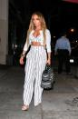 <p>For a date night in LA, the never-ageing Jennifer Lopez showed off those toned abs in a striped co-ord which she wore with a white jacket and block heels. [Photo: Getty] </p>