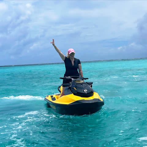 <p>Rebel Wilson/Instagram</p> Rebel Wilson rides a jet ski during Fiji vacation