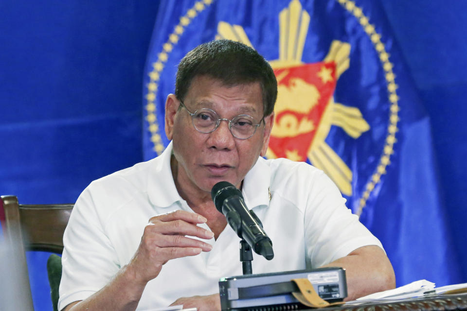 In this Monday, Feb. 15, 2021, photo provided by the Malacanang Presidential Photographers Division, Philippine President Rodrigo Duterte gestures as he meets members of the Inter-Agency Task Force on the Emerging Infectious Diseases in Davao city, southern Philippines. The Philippine president has approved an amnesty program for Muslim and communist rebels who would agree to surrender their weapons as they return to normal life in the latest such attempt to tame rural insurgencies that have raged for half a century. (Alberto Alcain/Malacanang Presidential Photographers Division via AP)