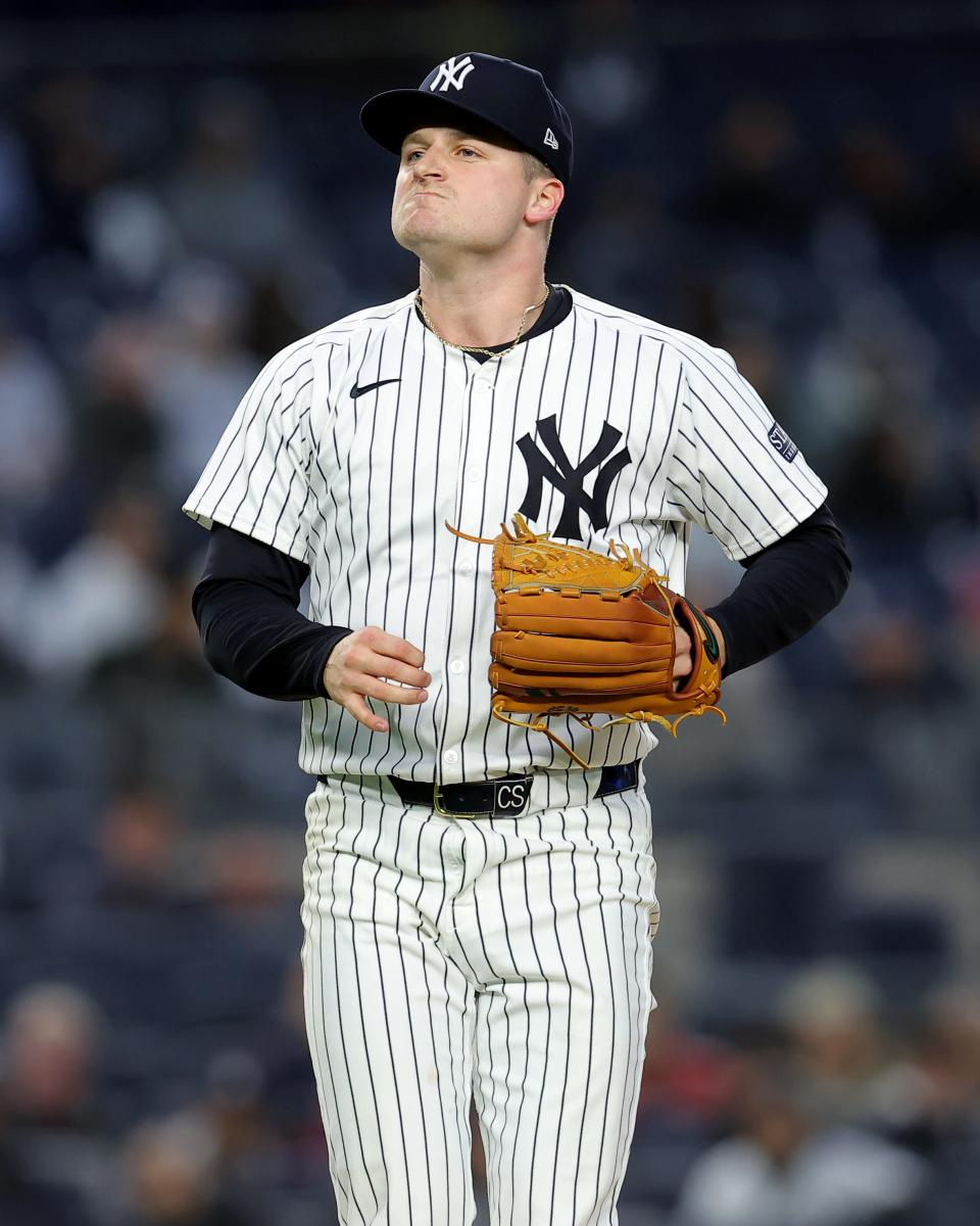 Apr 19, 2024; Bronx, New York, USA; New York Yankees starting pitcher Clarke Schmidt (36) reacts during the second inning against the Tampa Bay Rays at Yankee Stadium. Mandatory Credit: Brad Penner-USA TODAY Sports