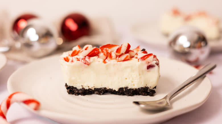 cheescake bar on white plate with spoon